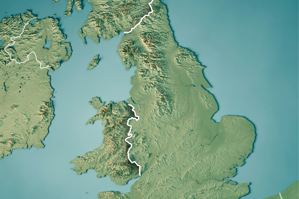 A shaded relief map of England and Wales, highlighting their border with a white line—a useful reference for Political Insider discussions during Local Elections. Surrounding areas such as Scotland, Ireland, and the seas are also visible.