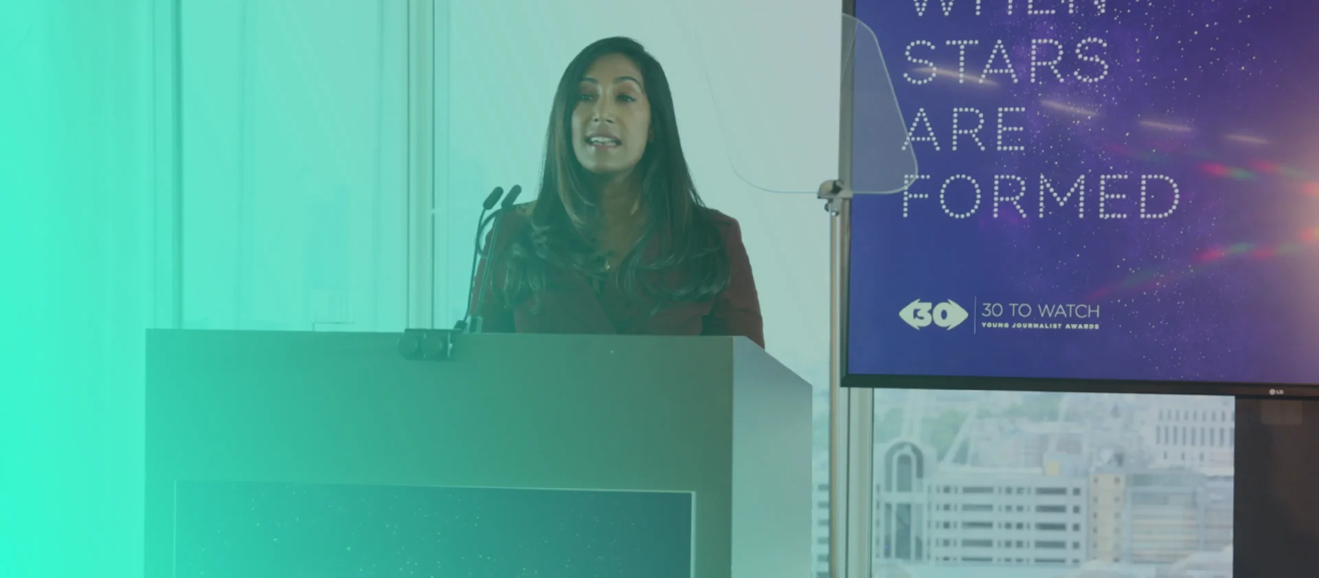 Woman presenting an award at event