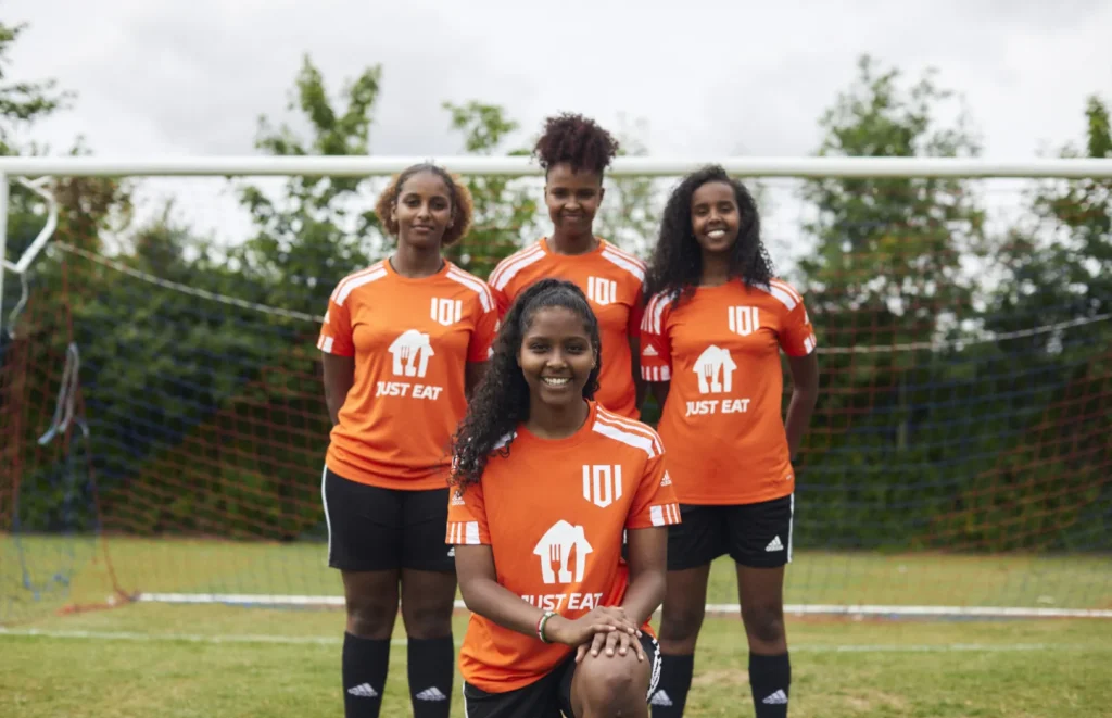 Girls playing football