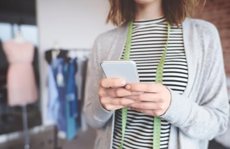 Small business owner texting