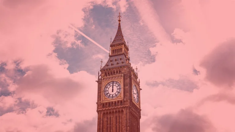 Big Ben clock tower in London against a cloudy sky, with an airplane contrail visible in the background. The image, tinted pink, captures an iconic UK landmark under dramatic skies.