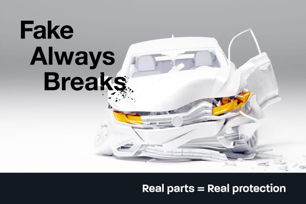 A white, heavily damaged car with crumpled front and open door. Black text reads, Fake Always Breaks. Below, a dark banner states, Real parts = Real protection. Campaign by the Intellectual Property Office.